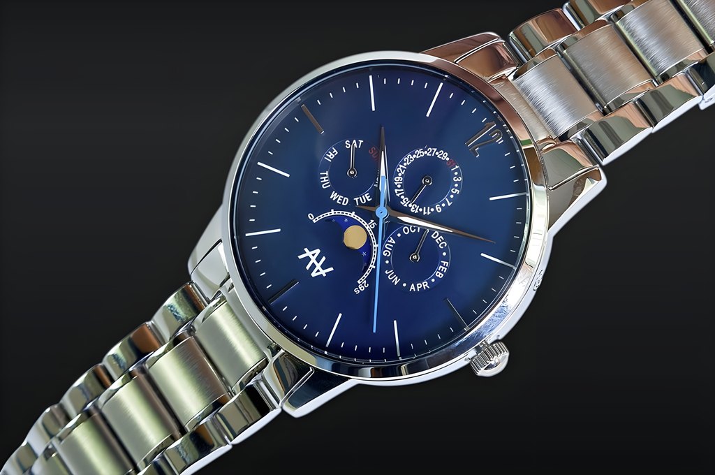 Blue Moon dial and stainless steel bracelet photographed on a dark surface