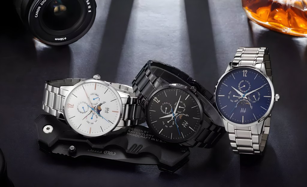 Three AV watches on steel bracelets laid out together